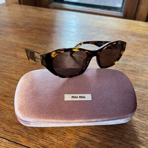 Miu Miu Tortoise Shell Cat Eye Sunglasses - SMU A03 Honey Havana/Dark Brown 53